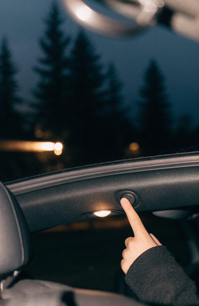 Switching off the car's dome light at night with a headlamp on