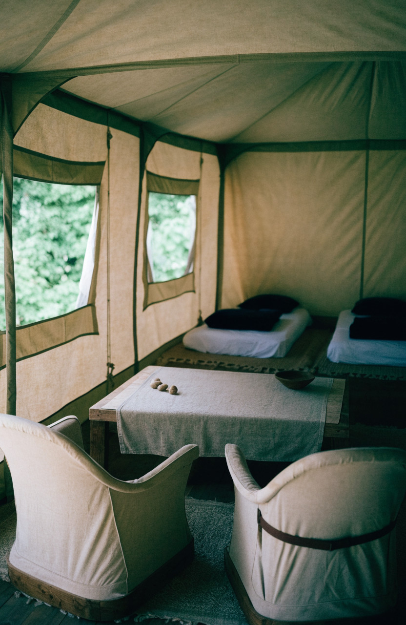 Cabin tent interior split into sleeping and living areas