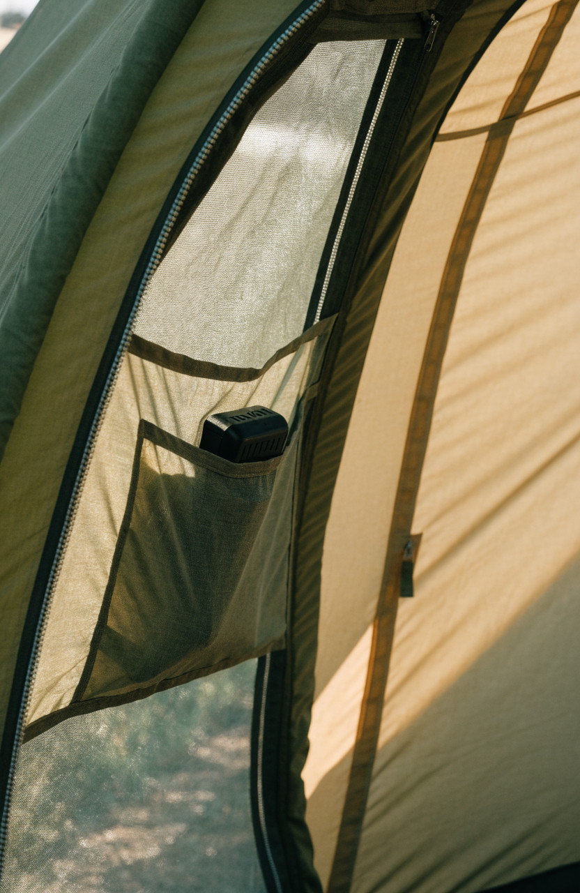 Small spare clip light stored in tent door pocket